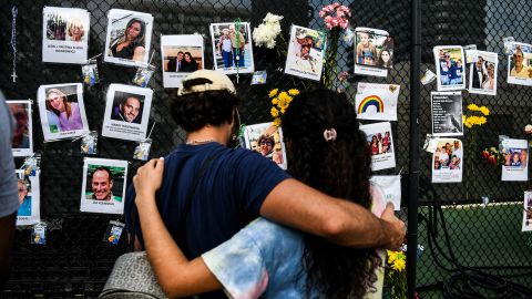 Mourners visit the makeshift memorial for those lost or missing in the collapse.