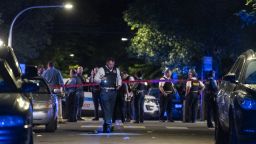 Chicago police work the scene where at least eight people were shot in the 6300 block of South Artesian Avenue in the Marquette Park neighborhood, late Sunday, June 27, 2021, in Chicago. (Tyler LaRiviere/Chicago Sun-Times via AP)