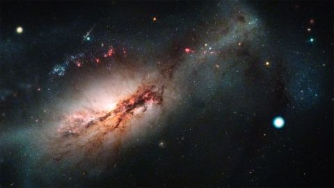 This image shows supernova 2018zd (pictured as the large white dot on the right), a new type of supernova called an electron capture. To the left is the galaxy NGC 2146.