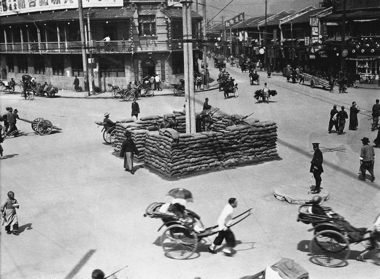 British troops guard a barricade on a street in Shanghai, China, in 1927. That year, the Kuomintang, or Chinese Nationalist Party, purged the Communist party in Shanghai, leading to a civil war between the Communists and Nationalists that would last more than 20 years. Thousands died in what the Nationalists called the "cleansing of the party." 