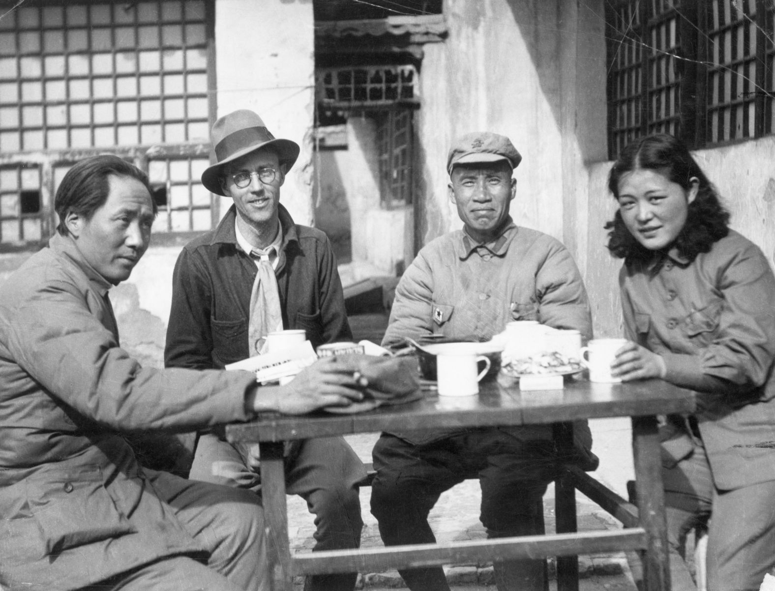Mao Zedong, left, is seen at the Chinese Communist headquarters in Yan'an, in northern China, in the 1930s. Mao rose from the peasant class to become the pre-eminent revolutionary theorist, political leader and statesman of communist China. Pictured with him here, from left, are United Press correspondent Earl Leaf, military leader Chu Teh and Mao's second wife, He Zizhen.
