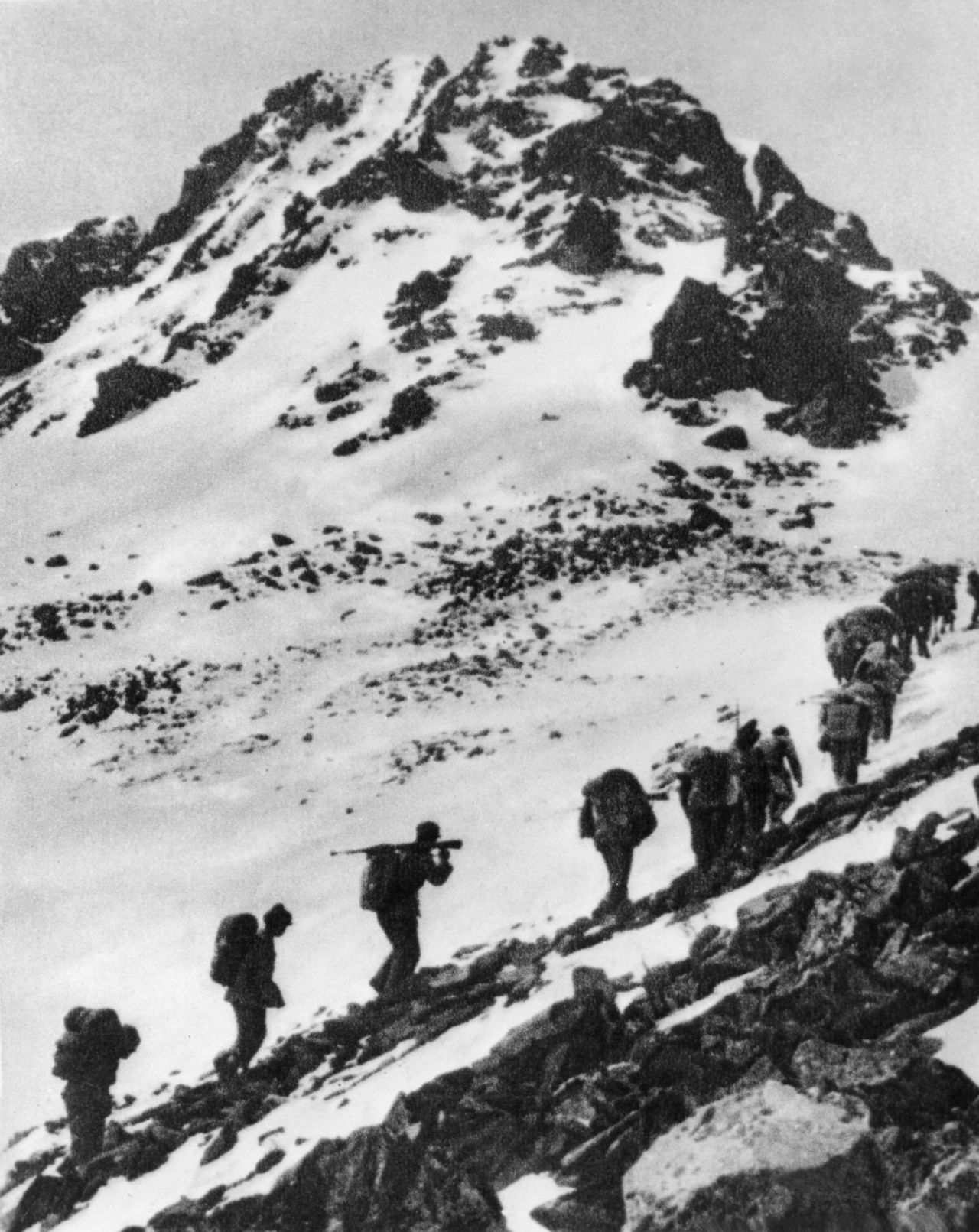 The Red Army, the Communist party force battling the Nationalists, climbs the snow-capped mountain of Jiajinshan in China's Sichuan province during the Long March in June 1935. The Long March was a yearlong journey taken by the communists to evade the Nationalist forces that had encircled them in southwest China. It spanned thousands of miles and ended in Yan'an.