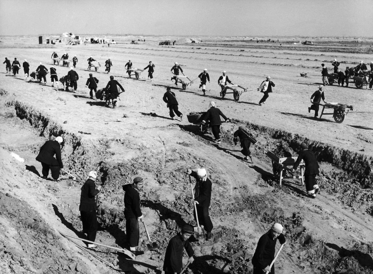 People in China's Shandong province build a water reservoir in February 1958. By the late 1950s, Mao was making plans to catch up quickly with the world's industrialized nations. During what became known as the Great Leap Forward, the Chinese government tried to advance the country's industrial and agricultural production by eliminating private farms and creating huge collectives. But the swift changes caused grain output to plummet, plunging China into a mass famine that would kill an estimated tens of millions of people.