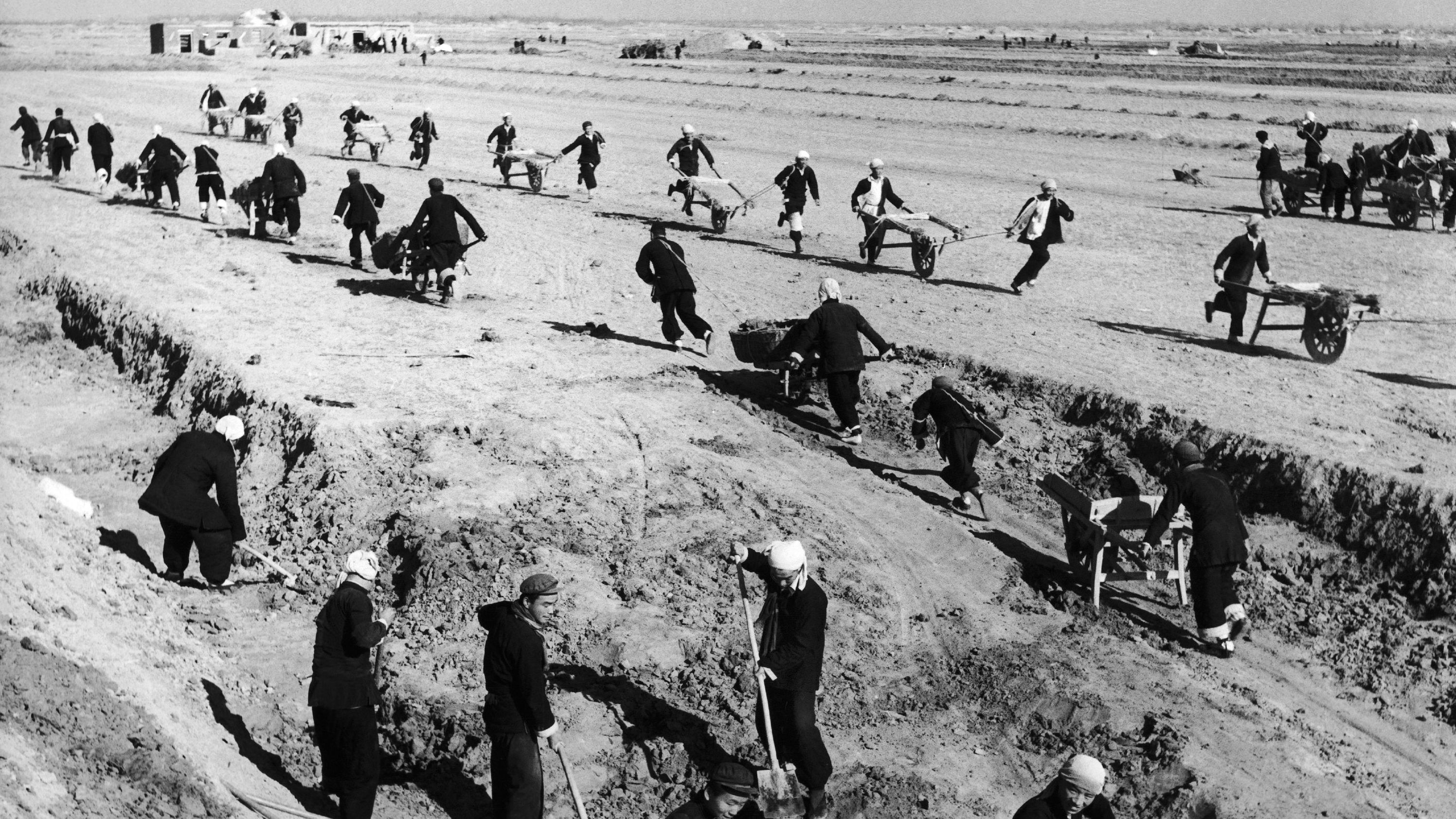 People in China's Shandong province build a water reservoir in February 1958. By the late 1950s, Mao was making plans to catch up quickly with the world's industrialized nations. During what became known as the Great Leap Forward, the Chinese government tried to advance the country's industrial and agricultural production by eliminating private farms and creating huge collectives. But the swift changes caused grain output to plummet, plunging China into a mass famine that would kill an estimated tens of millions of people.