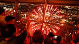 Spectators watch Fourth of July fireworks from the Stratosphere hotel and casino, Saturday, July 4, 2015, in Las Vegas. (AP Photo/John Locher)