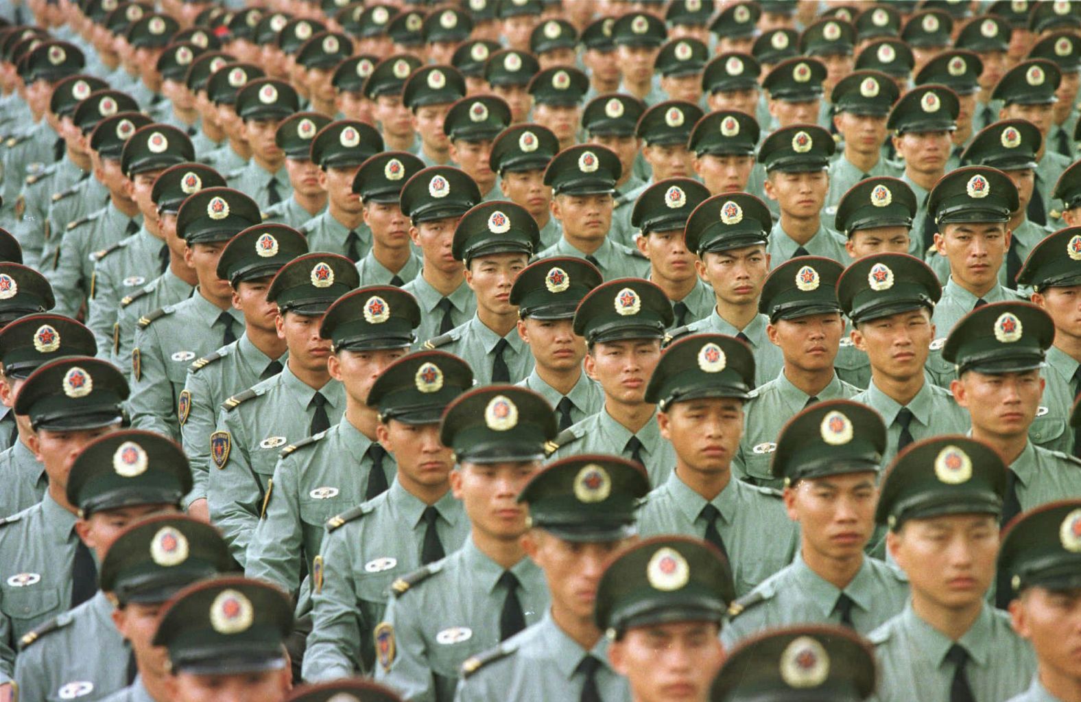 Chinese soldiers line up in formation on June 30, 1997, a day before the British colony of Hong Kong was returned to Chinese rule.