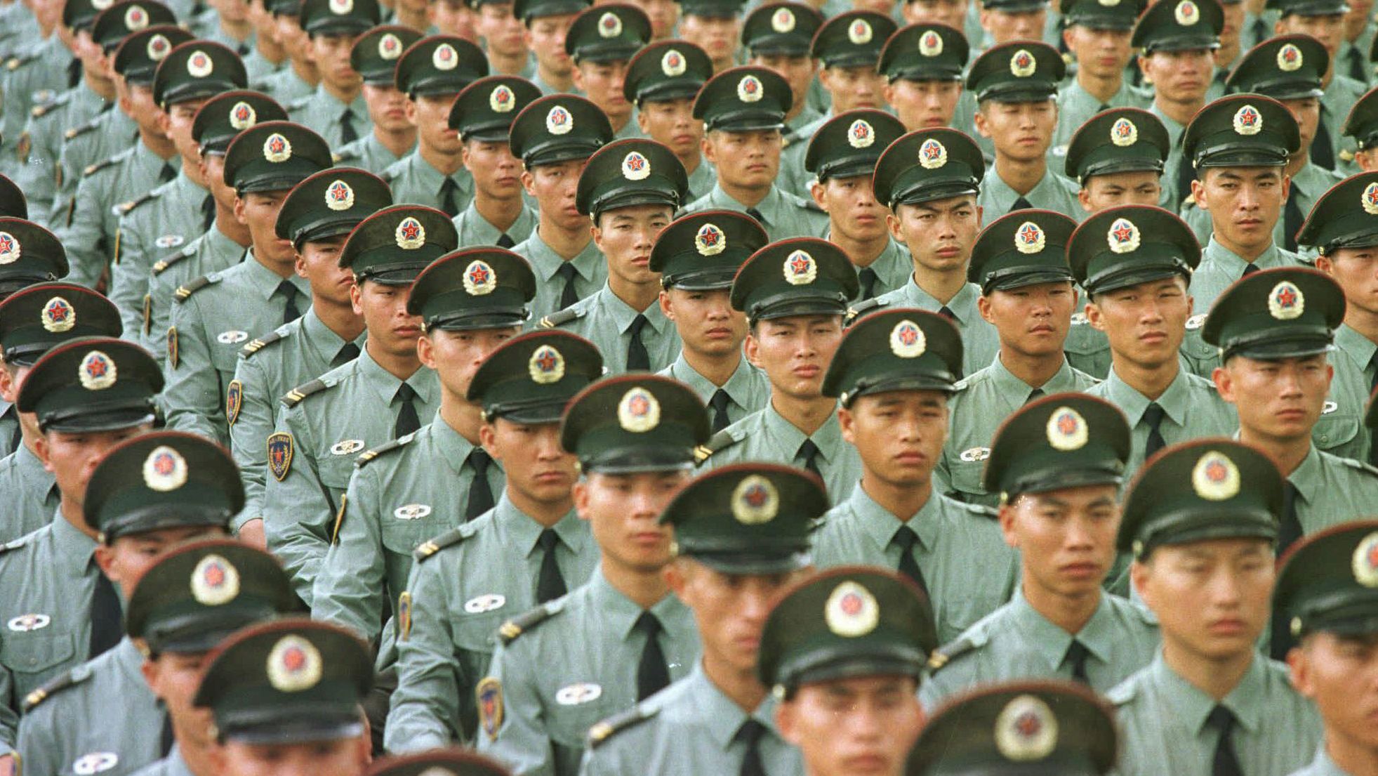 Chinese soldiers line up in formation on June 30, 1997, a day before the British colony of Hong Kong was returned to Chinese rule.