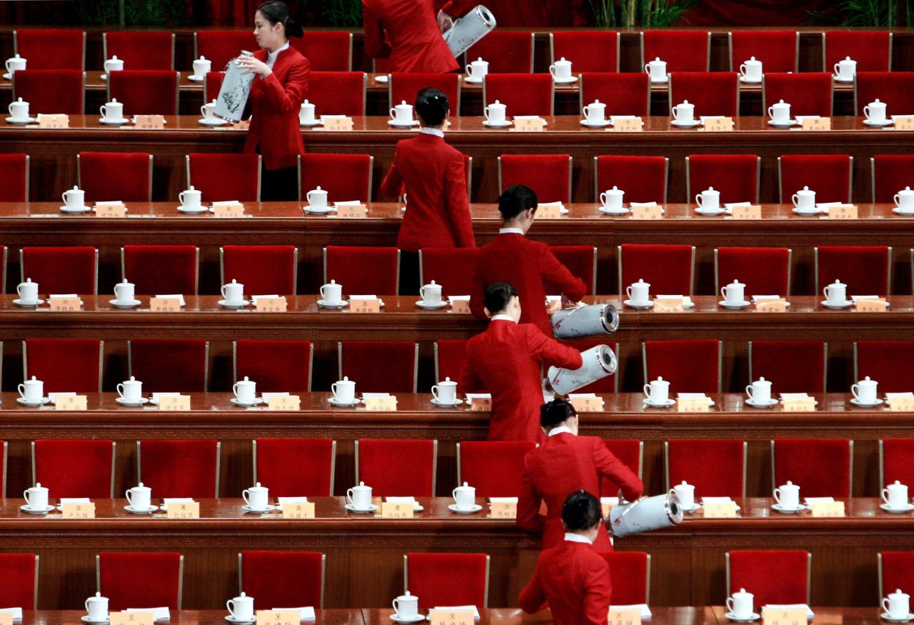 Hostesses pour tea before the opening session of the Chinese People's Political Consultative Conference in March 2008. The CPPCC is China's leading political advisory body.