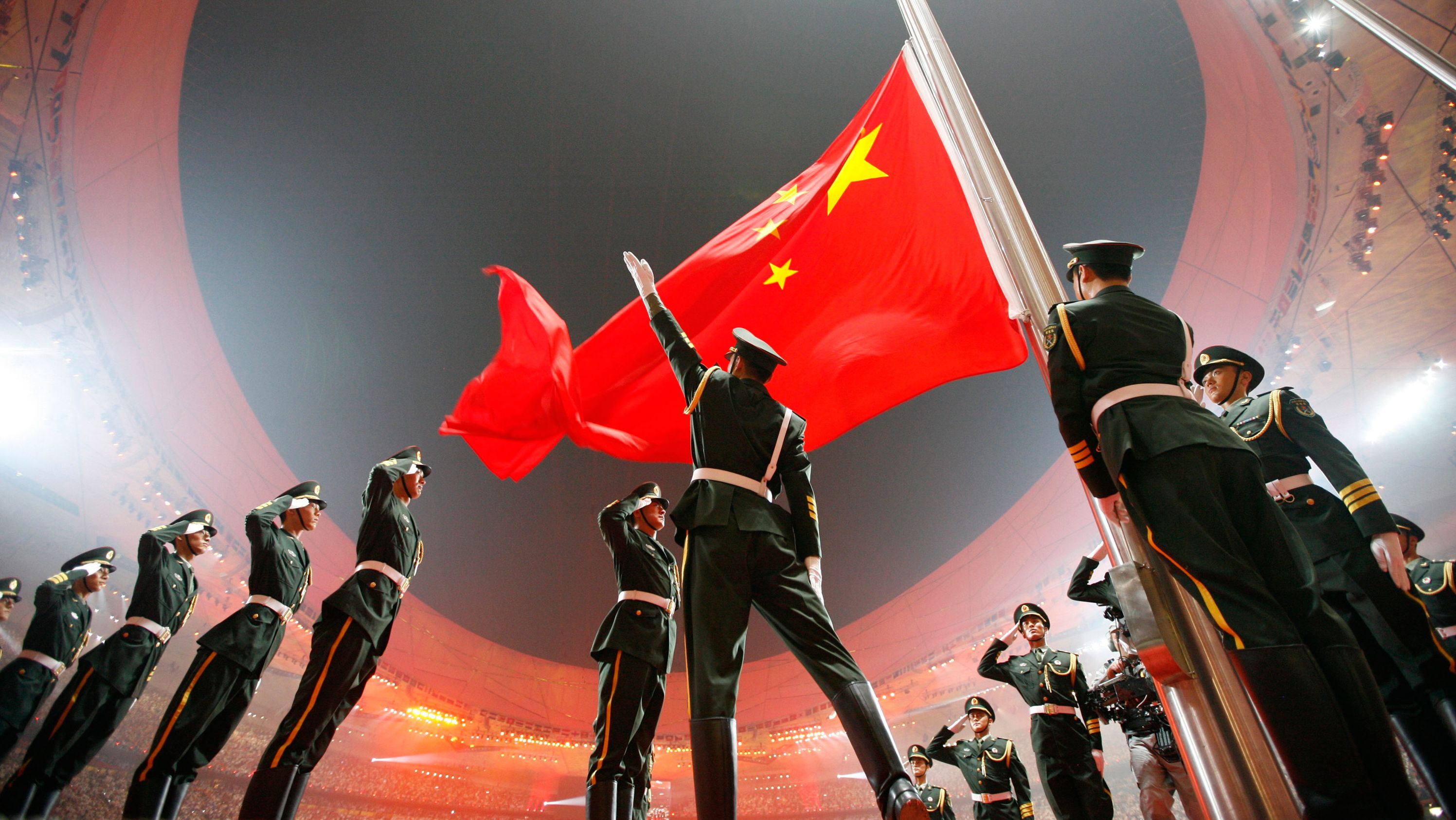China's flag is raised during the opening ceremony of the 2008 Summer Olympics, which were held in Beijing. China had never hosted the Olympics before, and in the run-up to the 2008 Games — held under the slogan "One World, One Dream" — <a href="https://www.cnn.com/2021/02/21/asia/beijing-olympics-2008-2022-soft-power-dst-intl-hnk/index.html" target="_blank">there were calls for a boycott</a> over the country's human-rights record.