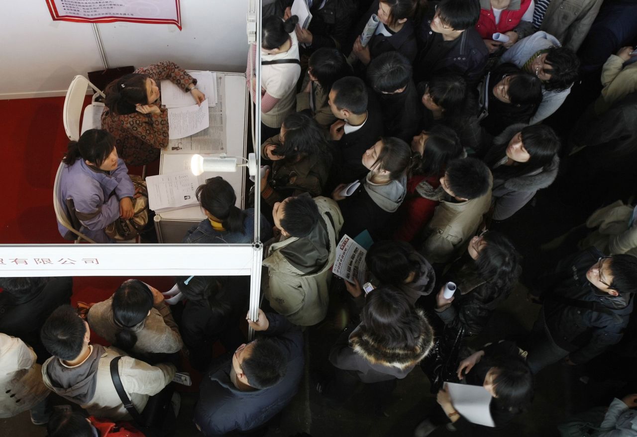 People wait to submit applications at a job fair in Beijing in March 2009. In 2010, <a href="https://money.cnn.com/2011/02/13/news/international/china_overtakes_japan_economy.cnnw/index.htm" target="_blank">China surpassed Japan</a> to become the world's second-largest economy.