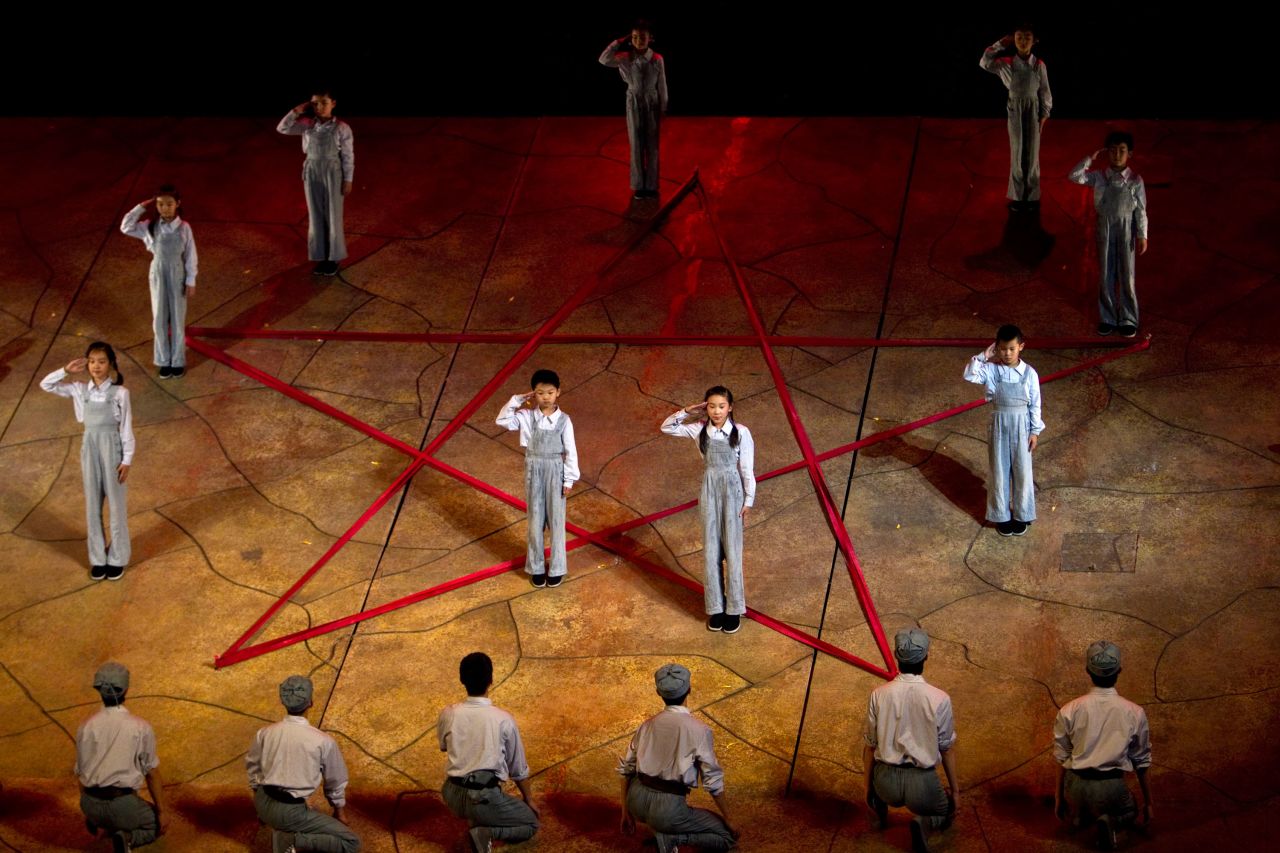 Young performers salute around the symbol of a red star during a rehearsal of "Yan'an Nursery" before its premiere in Yan'an, China, in 2011. Yan'an is celebrated as the birthplace of China's Communist revolution.