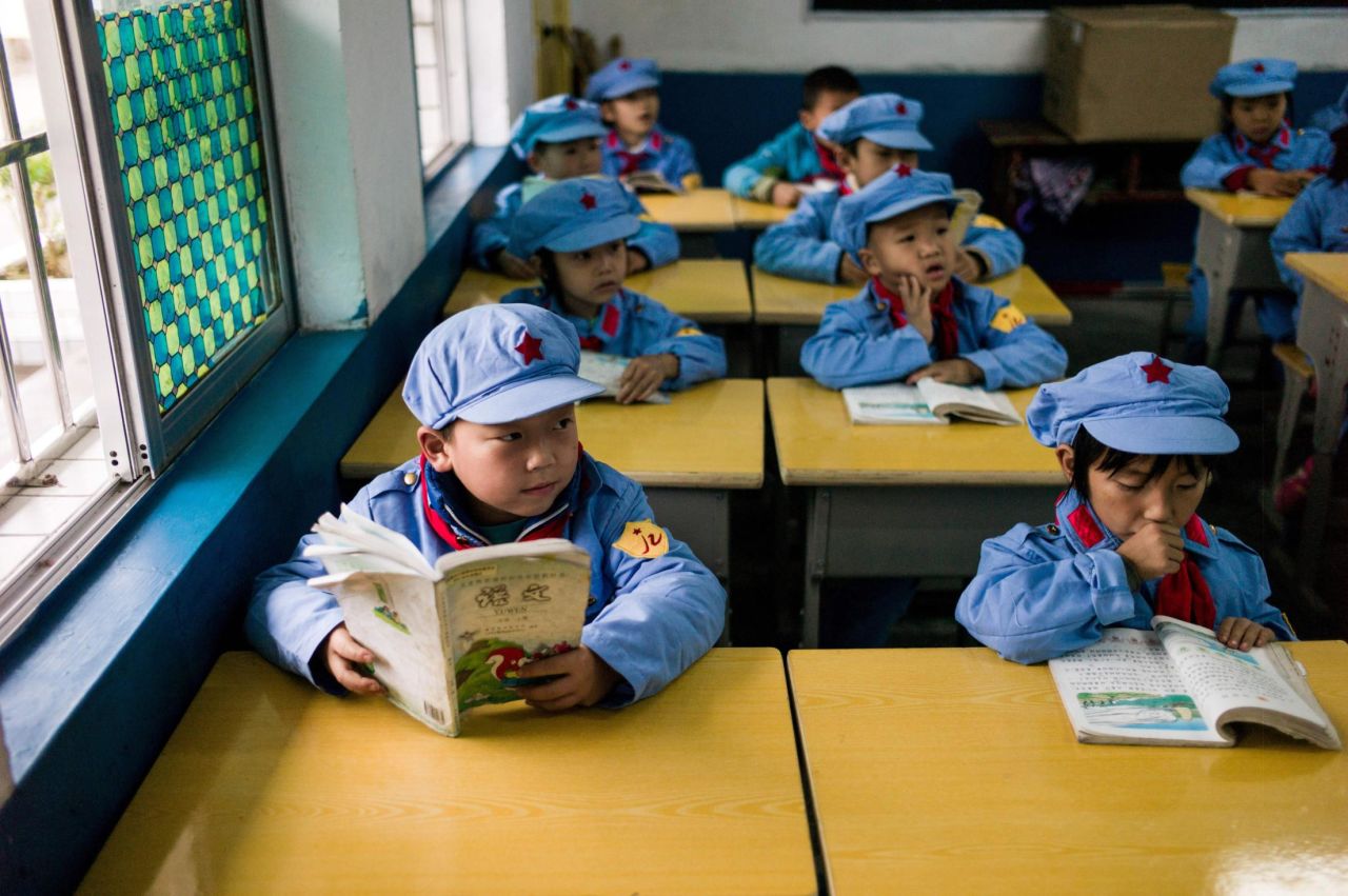 Students read at the Yang Dezhi elementary school in Wenshui, China, in 2016. Yeng Dezhi was designated as a "Red Army" school funded by China's "red nobility" of revolution-era Communist commanders and their families.