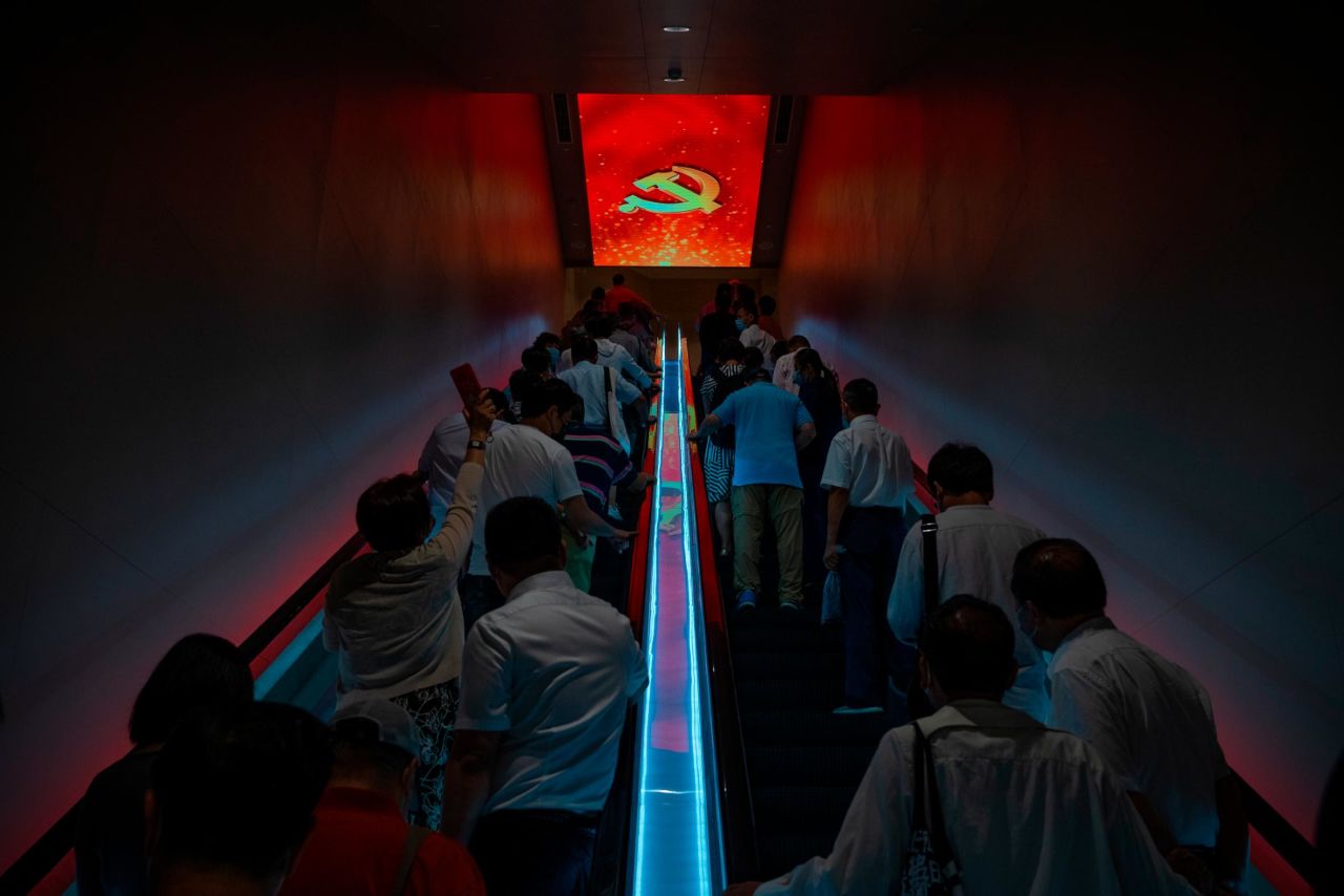 Visitors ride escalators at the Memorial of the First National Congress of the Communist Party of China, a museum in Shanghai, in June 2021.