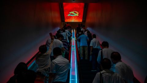 Visitors ride escalators at the Memorial of the First National Congress of the Communist Party of China, a museum in Shanghai, in June 2021.