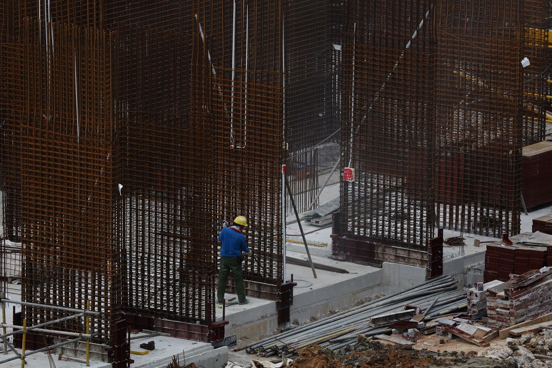 A migrant worker works at a building construction site on May 29, 2021 in Singapore. 