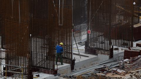 A migrant worker works at a building construction site on May 29, 2021 in Singapore. 