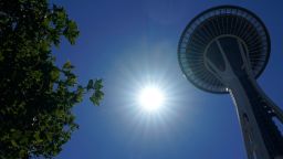 The sun shines near the Space Needle, Monday, June 28, 2021, in Seattle. Seattle and other cities broke all-time heat records over the weekend, with temperatures soaring well above 100 degrees Fahrenheit (37.8 Celsius). (AP Photo/Ted S. Warren)