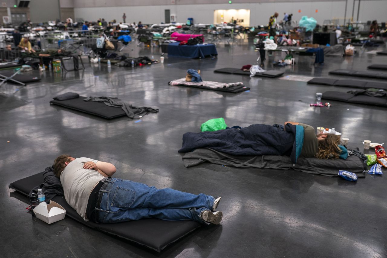 People in Portland, Oregon, cool off at the Oregon Convention Center on Sunday, June 27, 2021. Portland <a href="https://www.cnn.com/2021/06/28/weather/heat-waves-west-coast-records/index.html" target="_blank">set an all-time high of 112 degrees</a> that day. It surpassed it a day later with a high of 116.