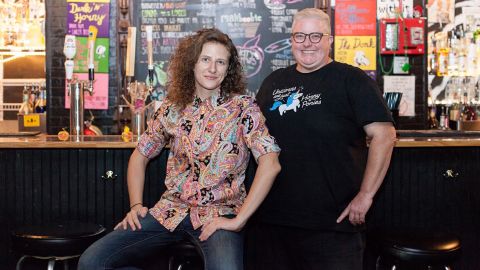 Nicci Boroski and Smoove Gardner, owners of The Back Door located in Bloomington, Indiana. To preserve the long-term future of their bar and entertainment space, Gardner purchased The Back Door's building. Many LGBTQ+ establishments, especially lesbian bars, have closed as a result of urban renewal and gentrification.