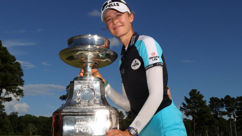 JOHNS CREEK, GEORGIA - JUNE 27: Nelly Korda poses with the trophy after putting in to win on the 18th green during the final round of the KPMG Women's PGA Championship at Atlanta Athletic Club on June 27, 2021 in Johns Creek, Georgia. (Photo by Kevin C. Cox/Getty Images)