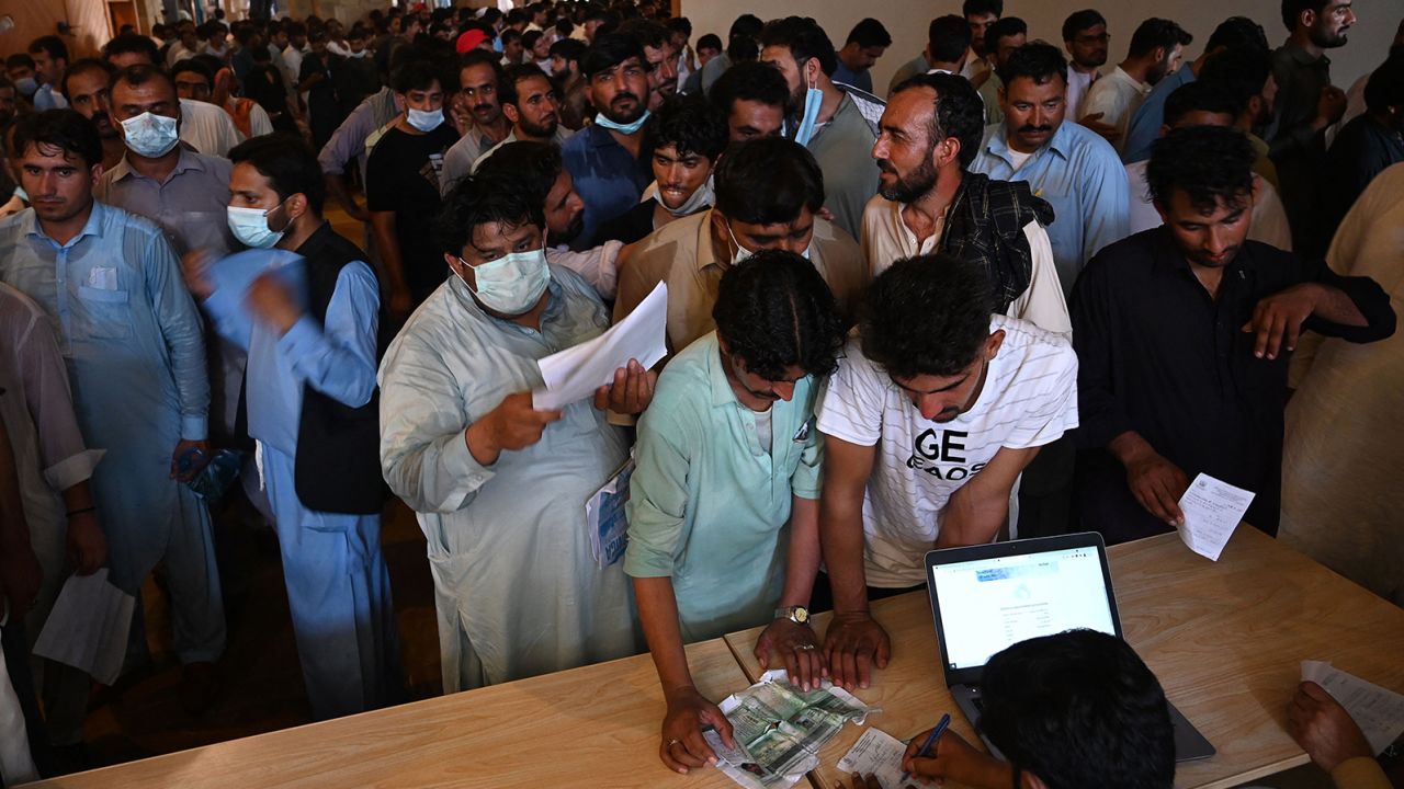 People including overseas Pakistani workers line up to register before for the Pfizer Covid-19 vaccine in Islamabad , Pakistan, on June 28.