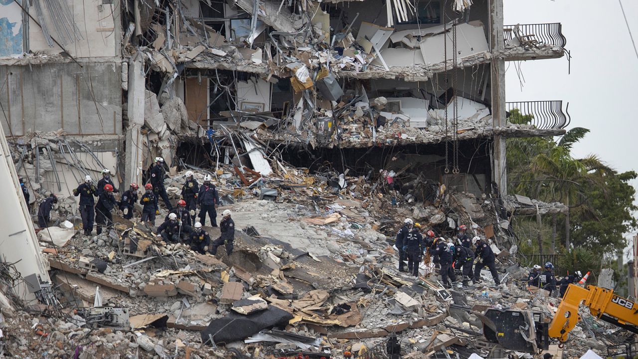 Rescue teams look for possible survivors and to recover remains in the partially collapsed 12-story Champlain Towers South condo building on June 28, 2021 in Surfside, Florida.