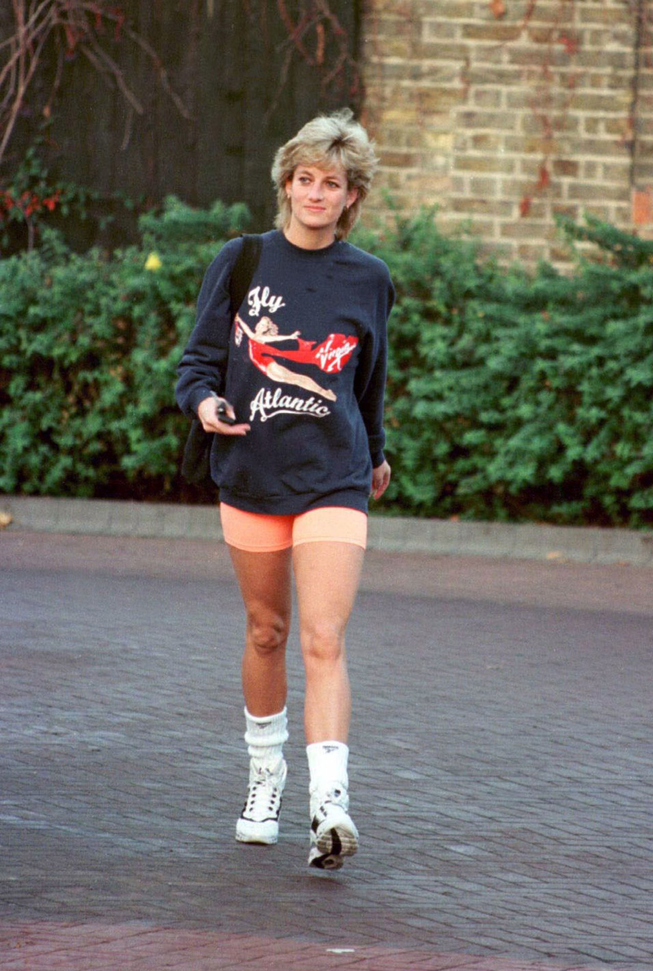 Princess Diana wearing a Virgin Atlantic sweater as she leaves the gym.