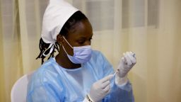 A medical worker prepares a second dose of Astra Zeneca vaccine in a vaccination centre in Kigali, on May 27, 2021.