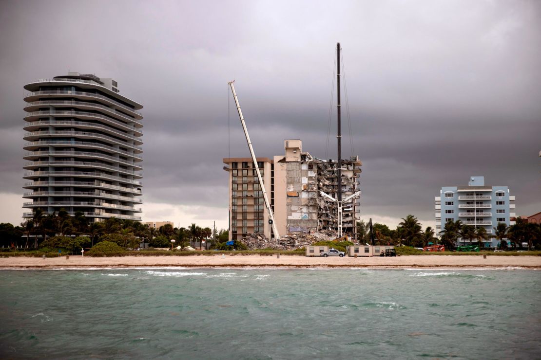 Ultra-luxury tower known as Eighty Seven Park, left, across from the ruins at Champlain Towers South.