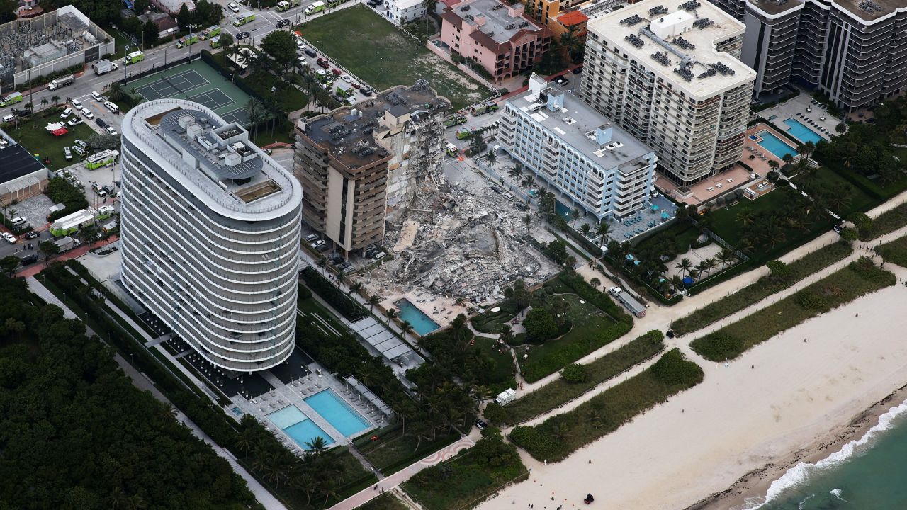 In this aerial view, search and rescue personnel work after the partial collapse of the 12-story Champlain Towers South condo building. Eighty Seven Park is to the left.