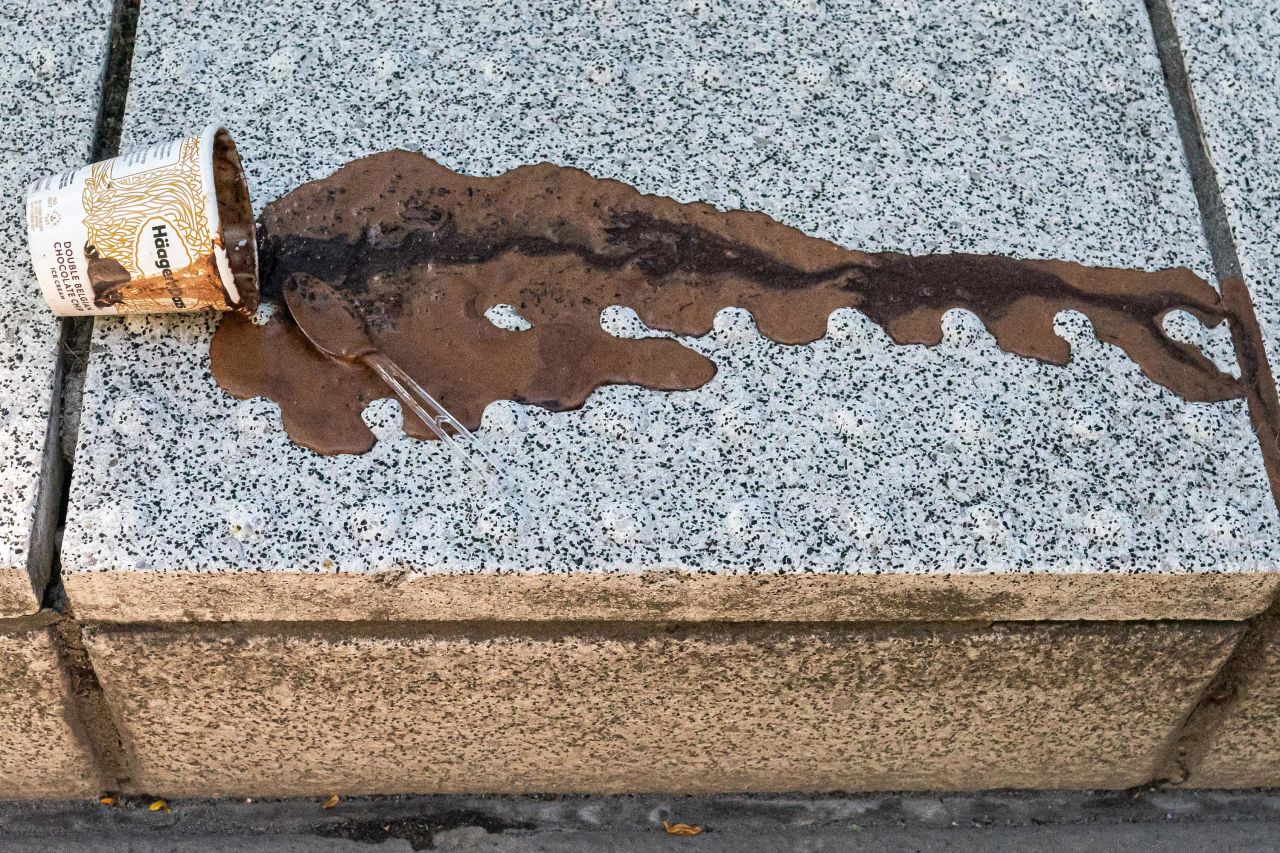 An abandoned pint of ice cream melts in Portland on Sunday.