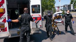 Paramedics respond to a heat exposure call in Salem, Oregon, during the record-setting heat wave in late June.