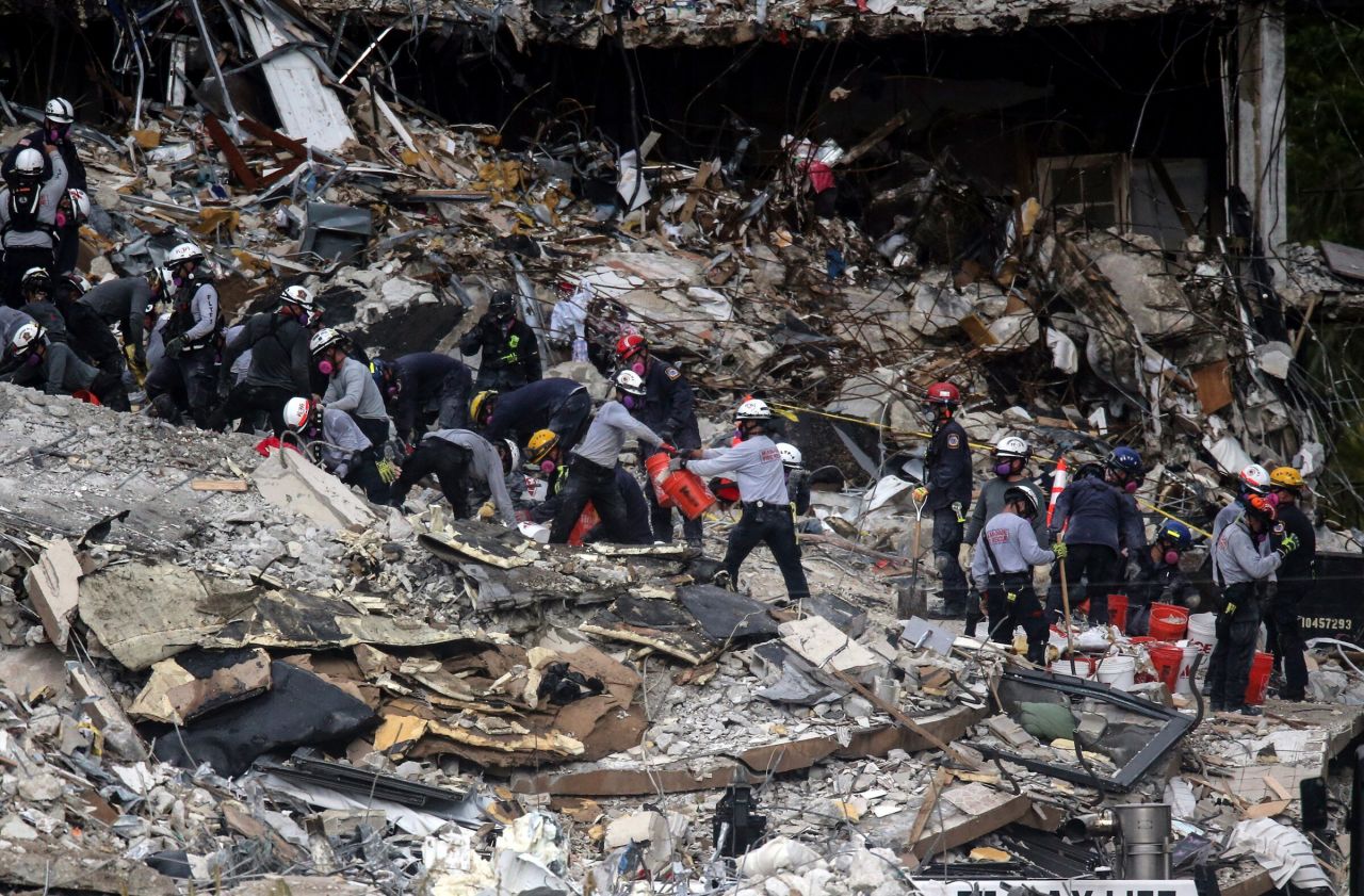 Search-and-rescue teams look through the rubble of Champlain Towers South on June 29.