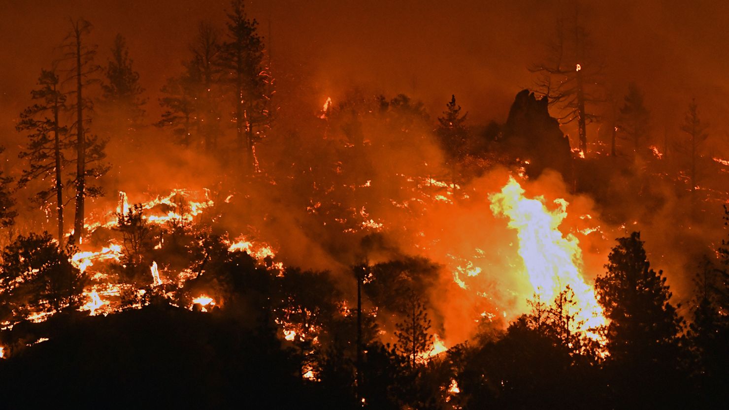 Flames from the Lava Fire burn along a ridge near US Highway 97 and Big Springs Road north of Weed, California, on Monday, June 28, 2021. 