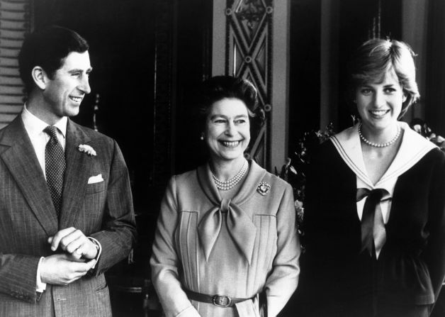 The couple poses with Charles' mother, Queen Elizabeth II, in March 1981. 