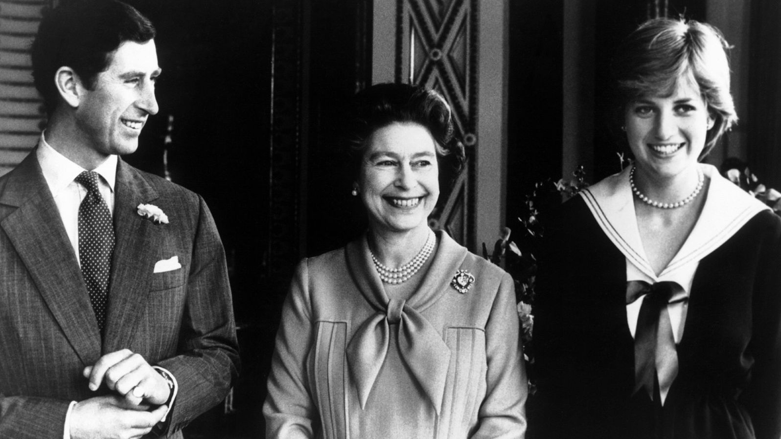 The couple poses with Charles' mother, Queen Elizabeth II, in March 1981. 