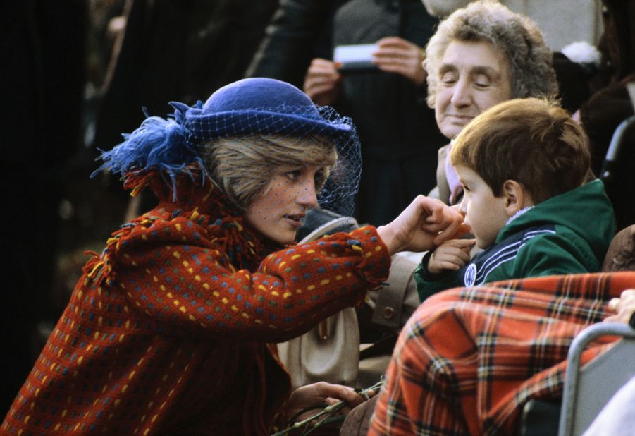 Diana greets a child while visiting Wrexham, Wales, in November 1982. 