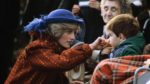 Diana greets a child while visiting Wrexham, Wales, in November 1982. 