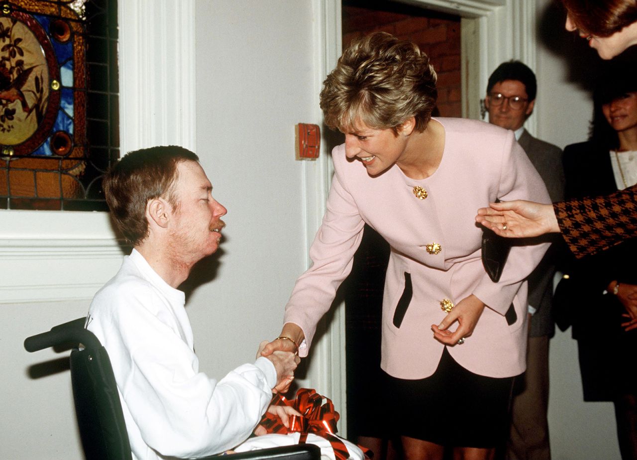 Diana shakes hands with a resident of Casey House, an AIDS Hospice, in Toronto, in October 1991. Diana's actions helped to break the stigmas associated with AIDS at the time. 