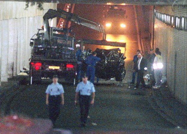 Wreckage is lifted away after the car Diana was in crashed into a pillar on August 31, 1997. Fayed and driver Henri Paul died at the scene. Diana died at a Paris hospital a few hours later. A French investigation concluded that Paul was legally drunk at the time and responsible for the accident. In 2008, a British coroner's jury found that Diana and Fayed were unlawfully killed because of the actions of Paul and pursuing paparazzi. 