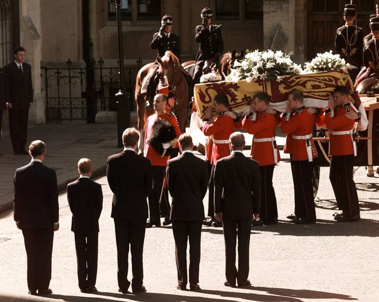 Diana's coffin is carried into London's Westminster Cathedral in September 1997. Watching at the bottom, from left, is Prince Charles, Prince Harry, Charles Spencer, Prince William and Prince Philip. 