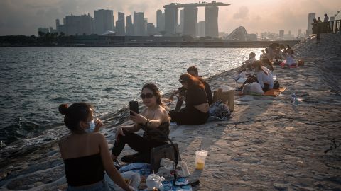 In May, Singapore reduced the number of people who could socialize together from five to two. 