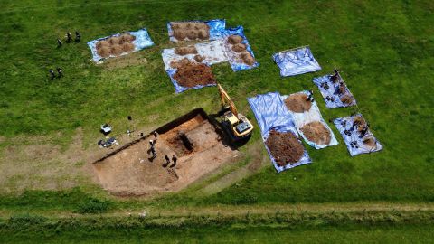 Archaeologists and American Defense POW/MIA Accounting Agency staff work to recover the remains of an American bomber crew, whose aircraft crashed at a site in Arundel in 1944.