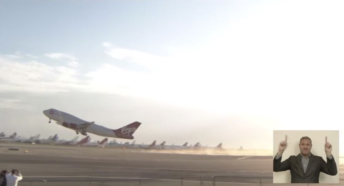 Virgin Orbit's retrofitted Boeing 747 airplane, with a rocket affixed beneath the wing, takes off from California ahead of launch.