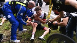 Team UAE Emirates' Marc Hirschi of Switzerland receives medical treatment after crashing during the 1st stage of the 108th edition of the Tour de France cycling race, 197 km between Brest and Landerneau, on June 26, 2021. (Photo by Anne-Christine POUJOULAT / POOL / AFP) (Photo by ANNE-CHRISTINE POUJOULAT/POOL/AFP via Getty Images)
