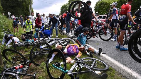 Italy's Kristian Sbaragli (left) and France's Bryan Coquard (right) lie on the ground after crashing during the first stage of the Tour de France.