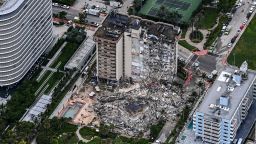 This aerial view, shows search and rescue personnel working on site after the partial collapse of the Champlain Towers South in Surfside, north of Miami Beach, on June 24, 2021. - The multi-story apartment block in Florida partially collapsed early June 24, sparking a major emergency response. Surfside Mayor Charles Burkett told NBCs Today show: My police chief has told me that we transported two people to the hospital this morning at least and one has died. We treated ten people on the site. (Photo by CHANDAN KHANNA / AFP) (Photo by CHANDAN KHANNA/AFP via Getty Images)