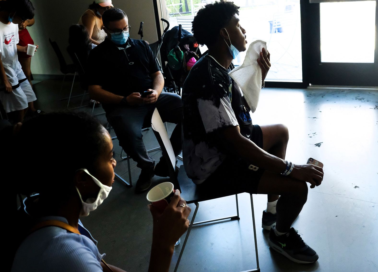 People escape the heat Tuesday at a cooling center in Spokane.