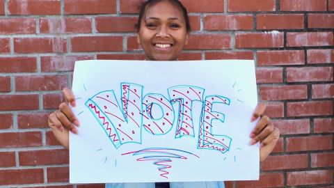 Nicolette Carrion, 18, shows her excitement to vote.