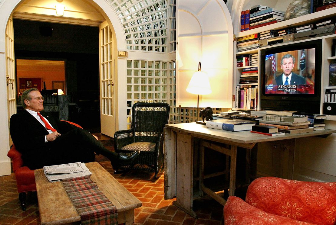 US Secretary of Defense Donald Rumsfeld watches President George W. Bush's speech from his home March 17, 2003, in Washington, DC. 